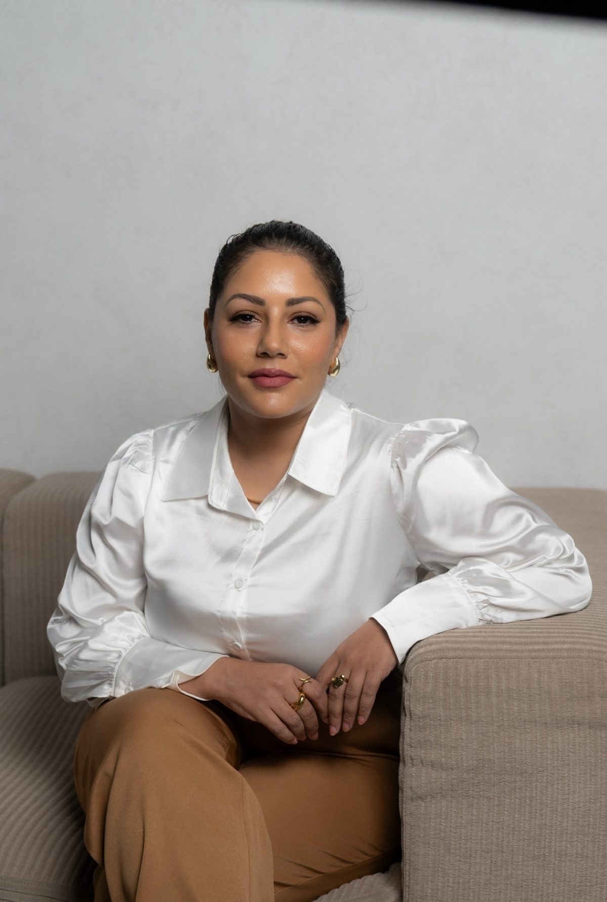 Wafa Fiture, RSW, seated in her counselling office in Markham